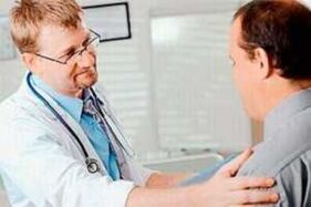 A man with prostatitis at a doctor's appointment for a doctor